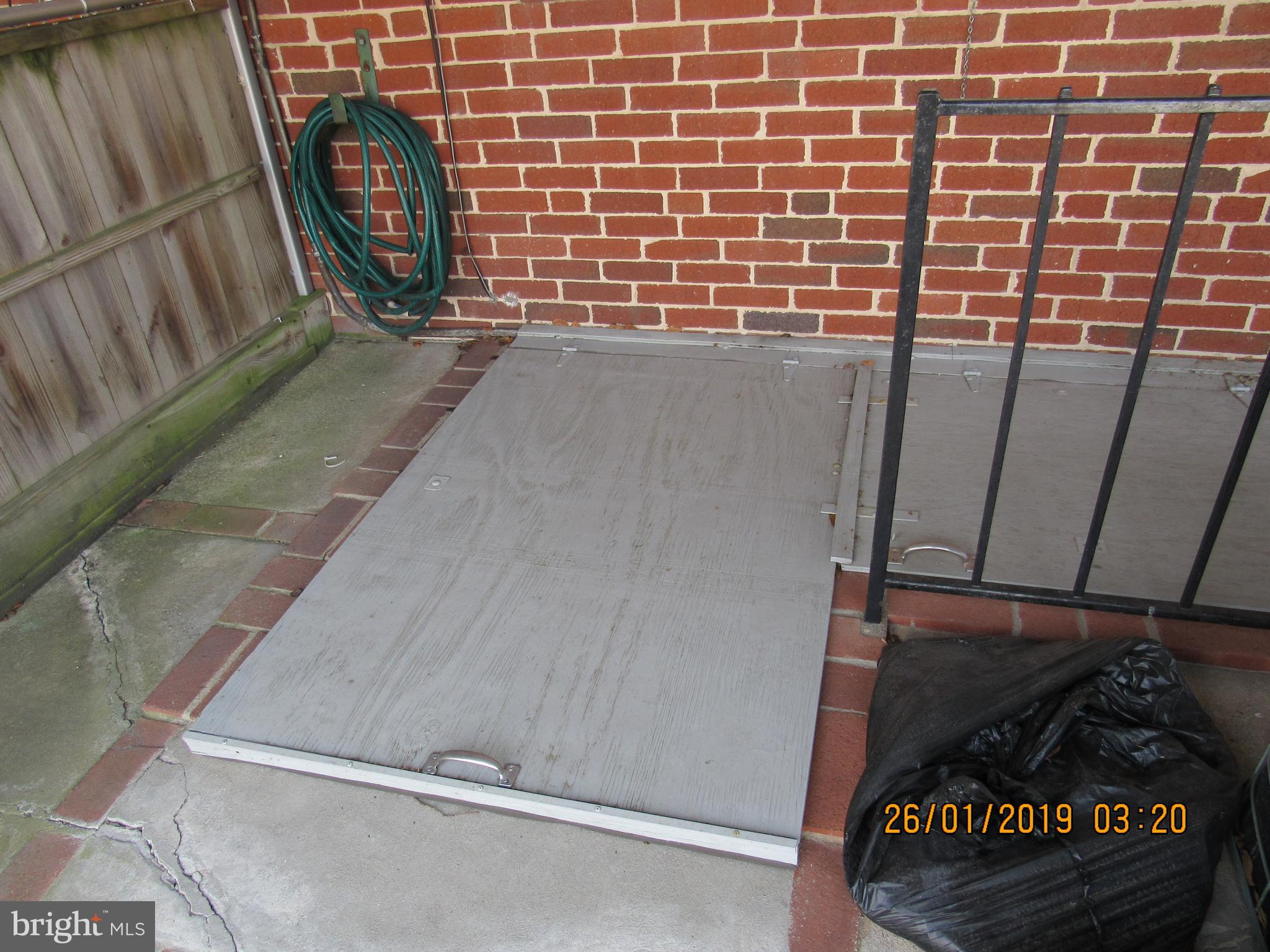 1524 Tunlaw Road Baltimore, MD 21218 - Photo 32 of 34 The walk up has been covered