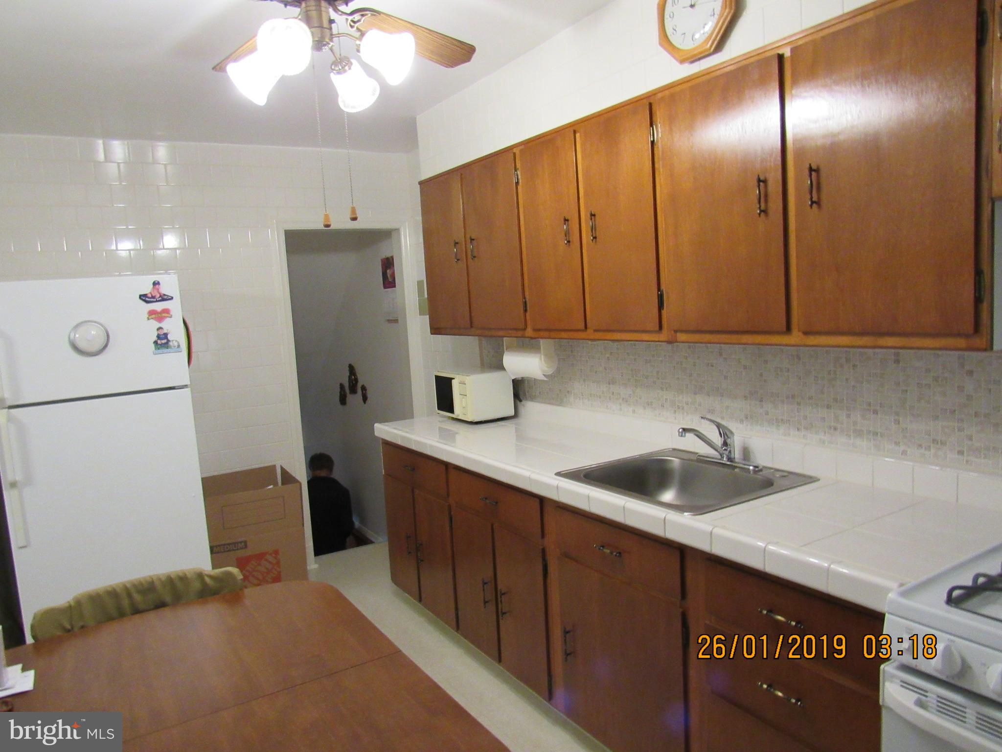 1524 Tunlaw Road Baltimore, MD 21218 - Photo 8 of 34 Kitchen with door way to basement
