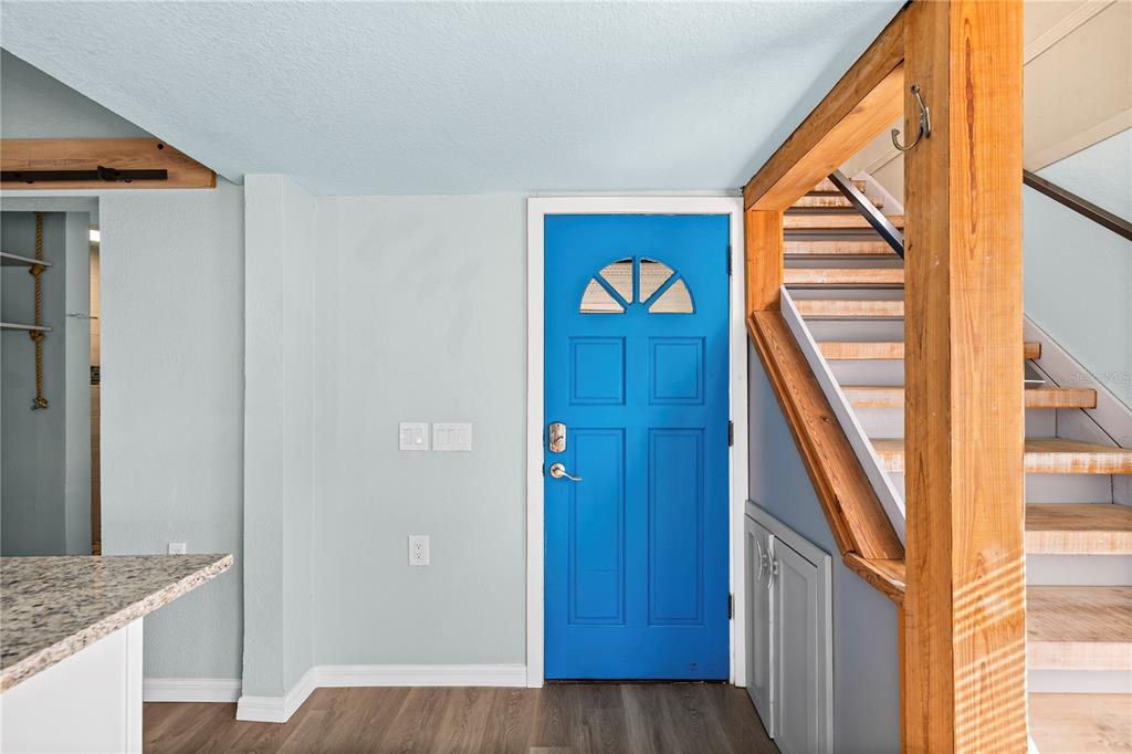 5642 Riverview Drive New Port Richey, FL 34652 - Photo 13 of 41 a view of a hallway with wooden floor and entryway