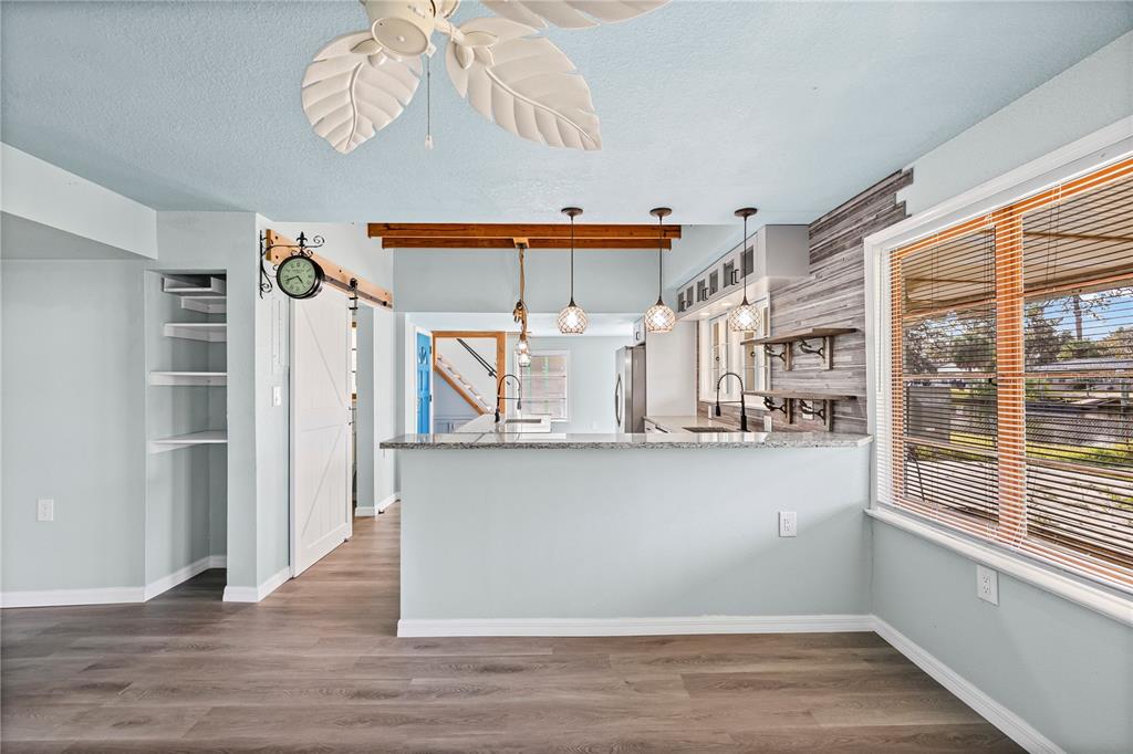 5642 Riverview Drive New Port Richey, FL 34652 - Photo 14 of 41 a view of a kitchen with a window and a refrigerator
