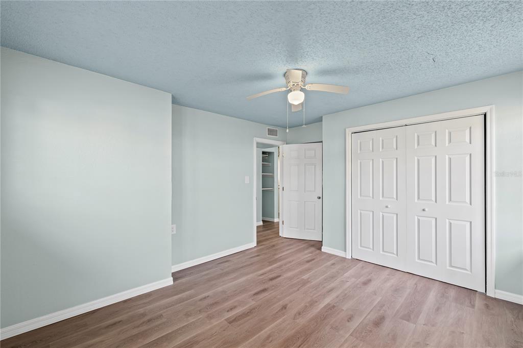 5642 Riverview Drive New Port Richey, FL 34652 - Photo 18 of 41 a view of empty room with wooden floor