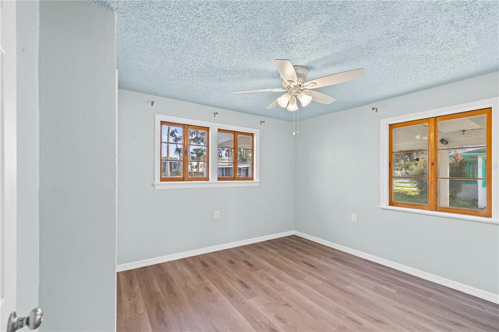 5642 Riverview Drive New Port Richey, FL 34652 - Photo 19 of 41 an empty room with a window and a ceiling fan