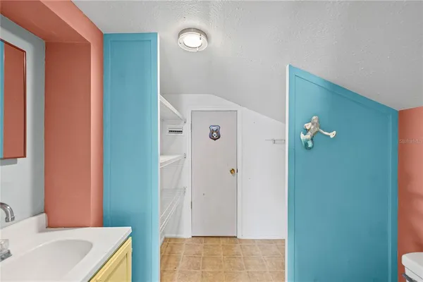 a bathroom with a sink and mirror