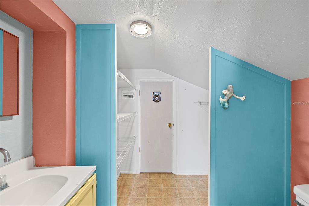 5642 Riverview Drive New Port Richey, FL 34652 - Photo 23 of 41 a bathroom with a sink and mirror