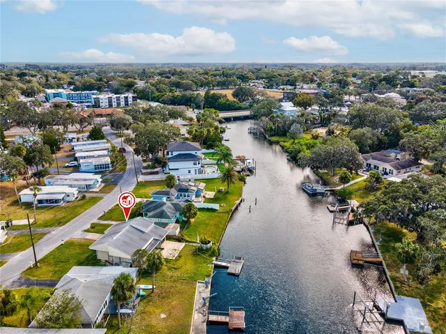 an aerial view of a houses with a lake view