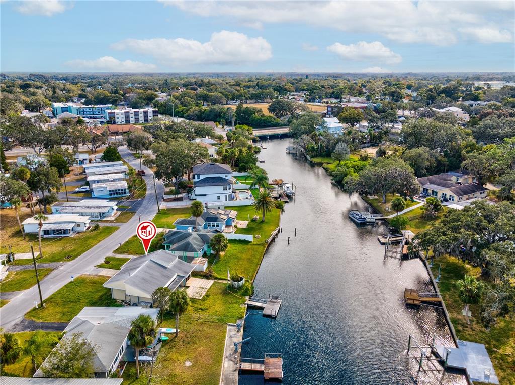 5642 Riverview Drive New Port Richey, FL 34652 - Photo 28 of 41 an aerial view of a houses with a lake view