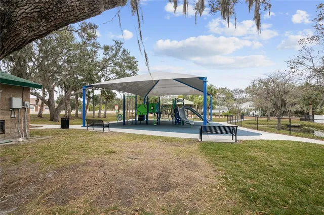 a view of a park with sitting area