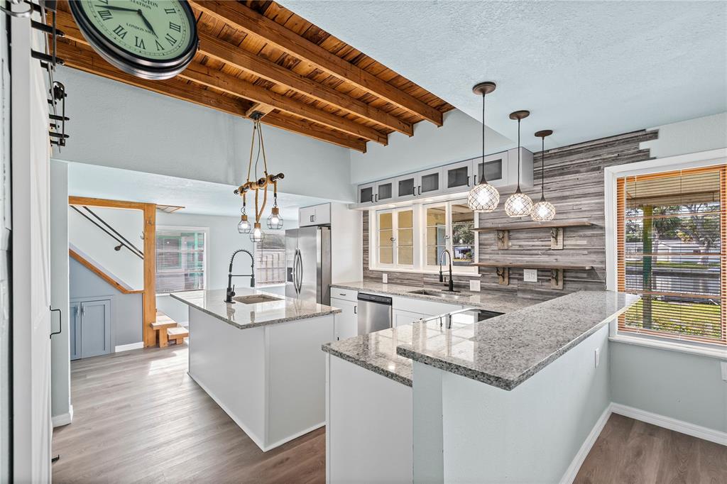 5642 Riverview Drive New Port Richey, FL 34652 - Photo 7 of 41 a kitchen with a sink and a wooden floor
