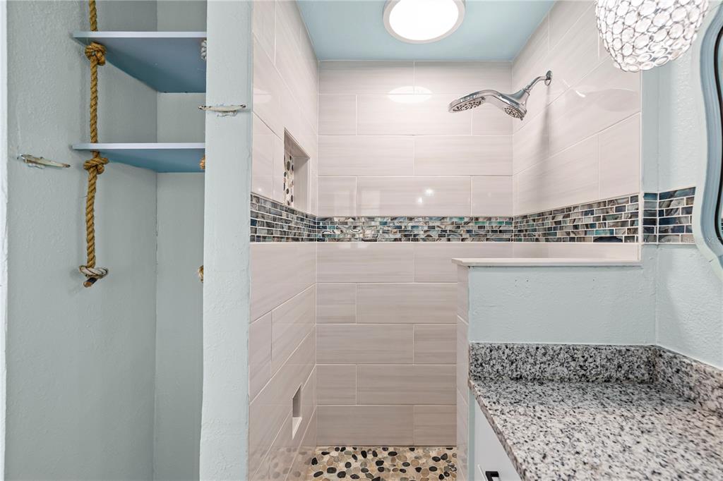 5642 Riverview Drive New Port Richey, FL 34652 - Photo 9 of 41 a bathroom with a shower