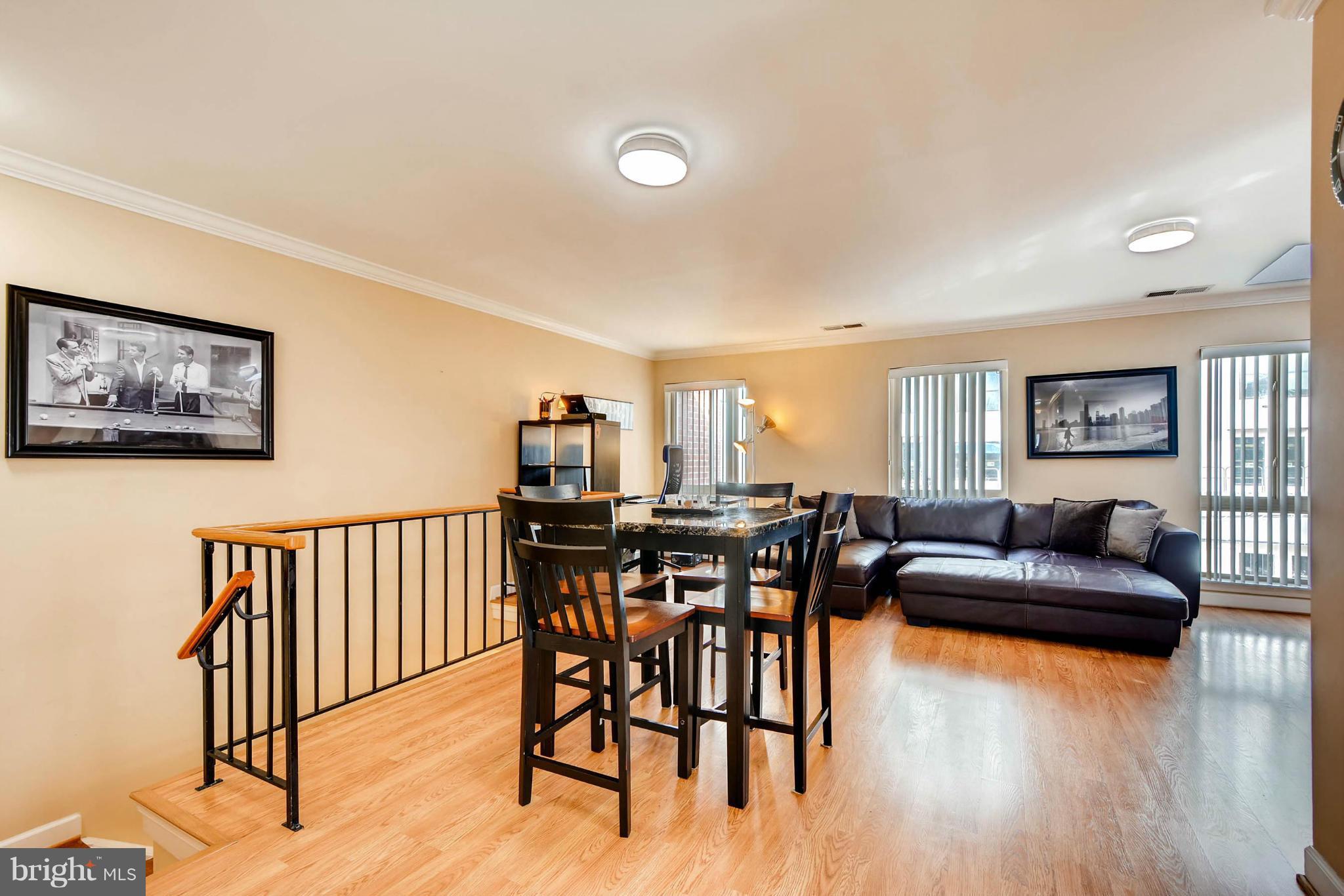 620 Charles Street, Unit R33 Baltimore, MD 21230 - Photo 11 of 27 a view of a livingroom with furniture and wooden floor
