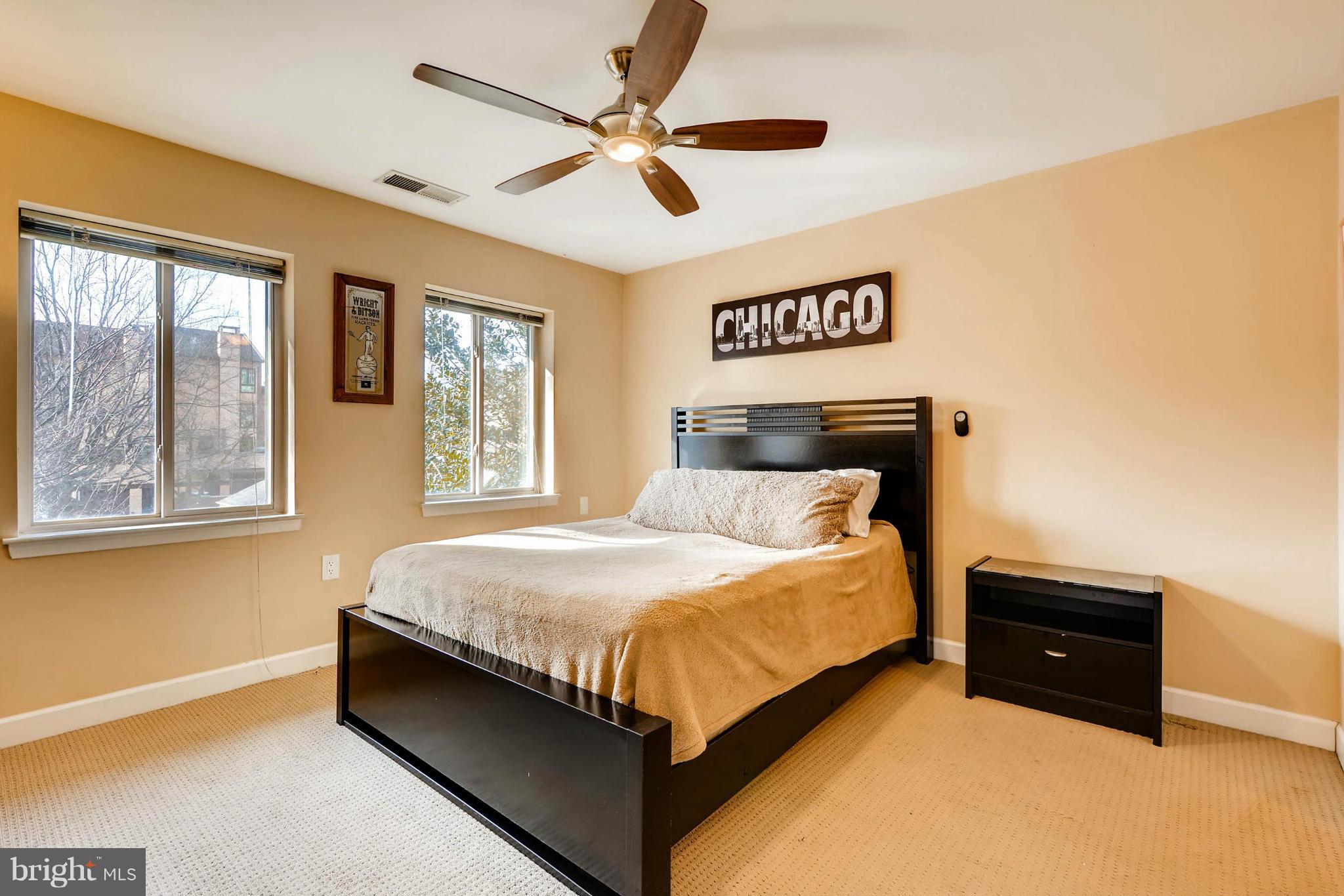 620 Charles Street, Unit R33 Baltimore, MD 21230 - Photo 13 of 27 a bedroom with a bed and window