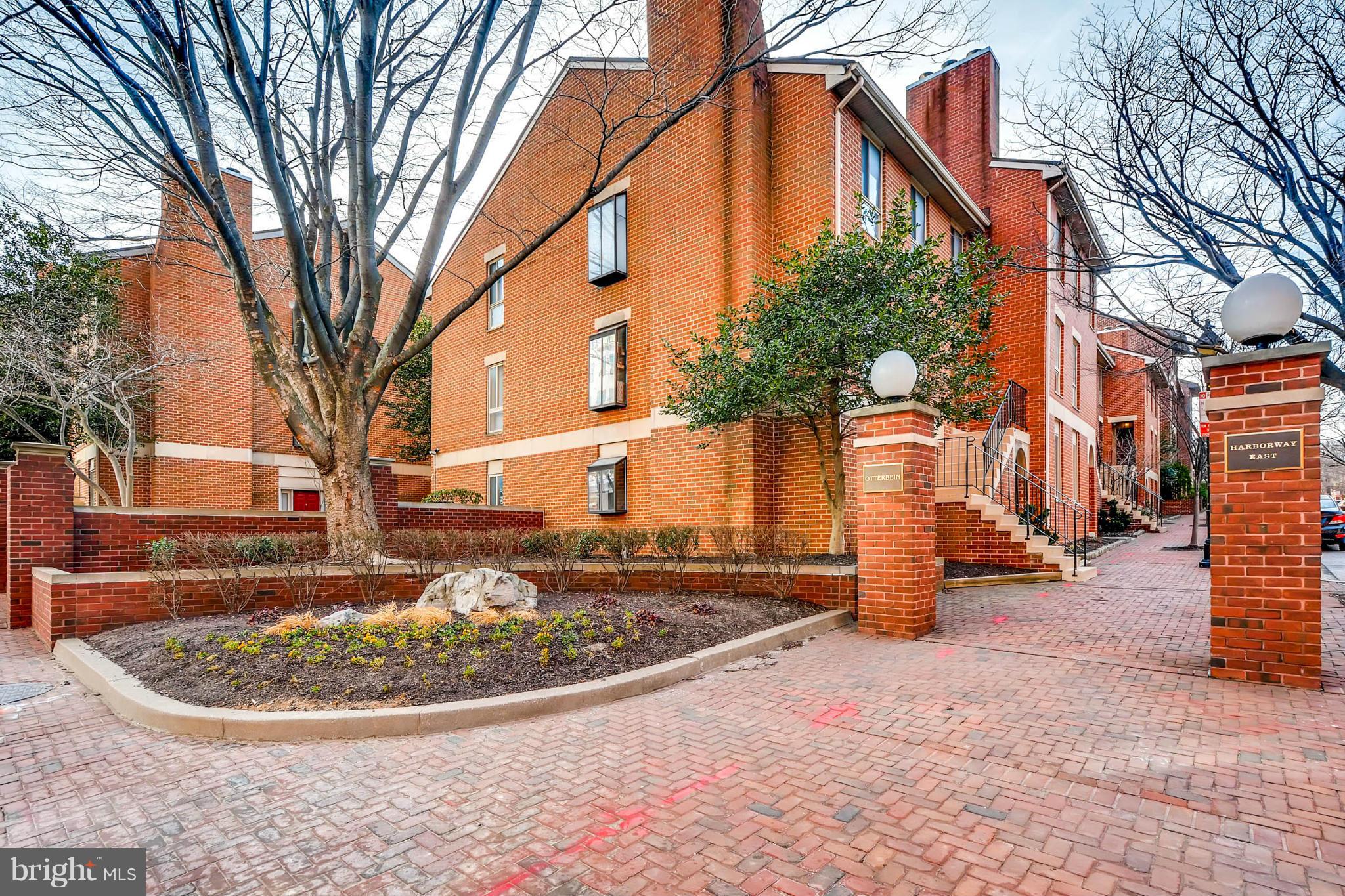 620 Charles Street, Unit R33 Baltimore, MD 21230 - Photo 4 of 27 a view of a house with a pathway
