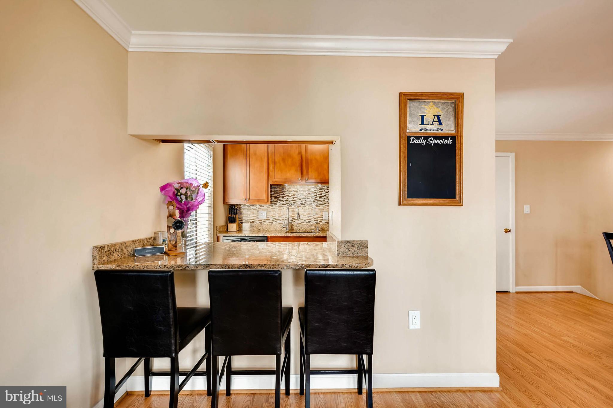 620 Charles Street, Unit R33 Baltimore, MD 21230 - Photo 7 of 27 a dining room with furniture and window