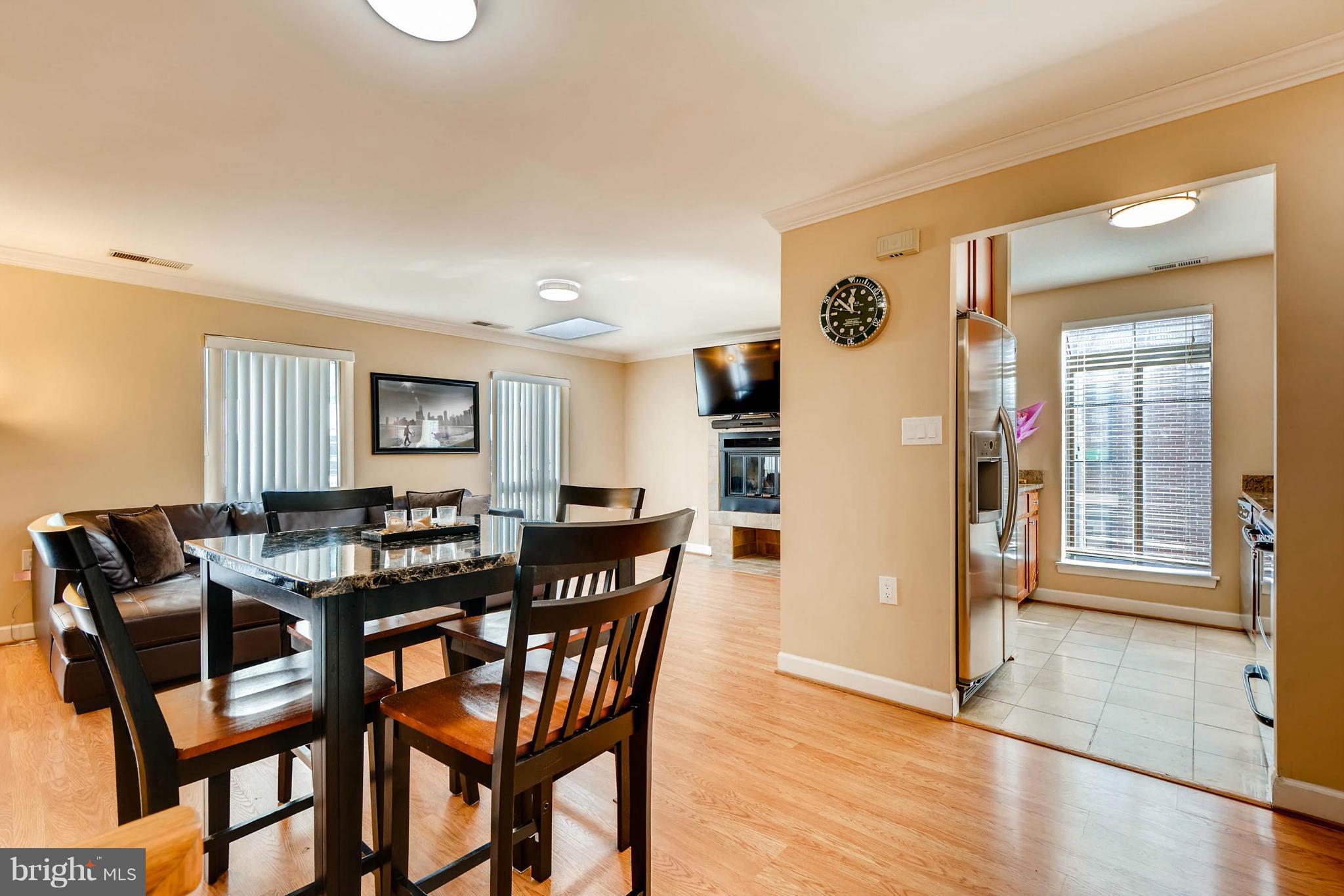 620 Charles Street, Unit R33 Baltimore, MD 21230 - Photo 10 of 27 a view of a dining room with furniture and wooden floor