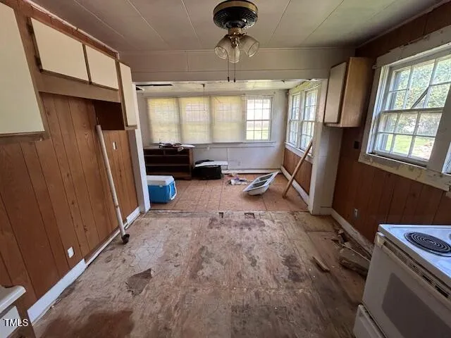 a view of a livingroom with furniture hardwood floor and a window