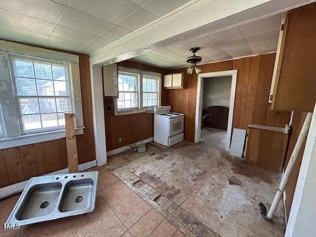 a utility room with closet dryer and washer