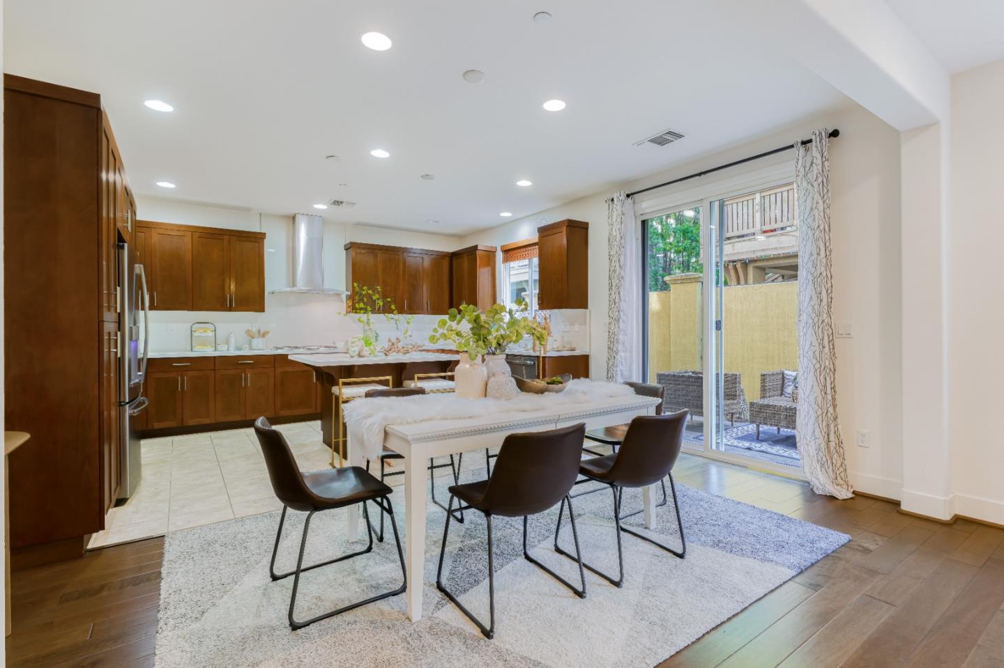 37431 Talamore Common Fremont, CA 94536 - Photo 11 of 41 a view of a dining room with furniture window and wooden floor