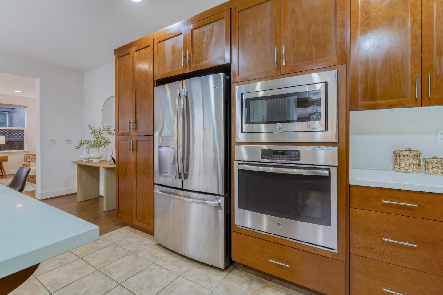 37431 Talamore Common Fremont, CA 94536 - Photo 14 of 41 a kitchen with granite countertop white cabinets and stainless steel appliances