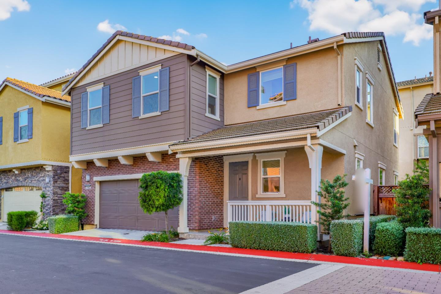 37431 Talamore Common Fremont, CA 94536 - Photo 2 of 41 a front view of a house with a yard and garage