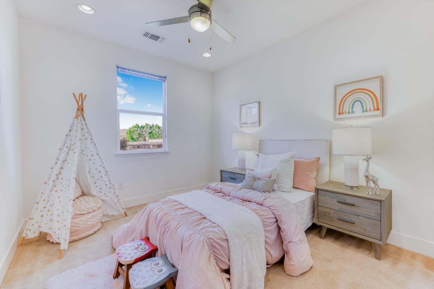 37431 Talamore Common Fremont, CA 94536 - Photo 22 of 41 a bedroom with a bed and a chandelier