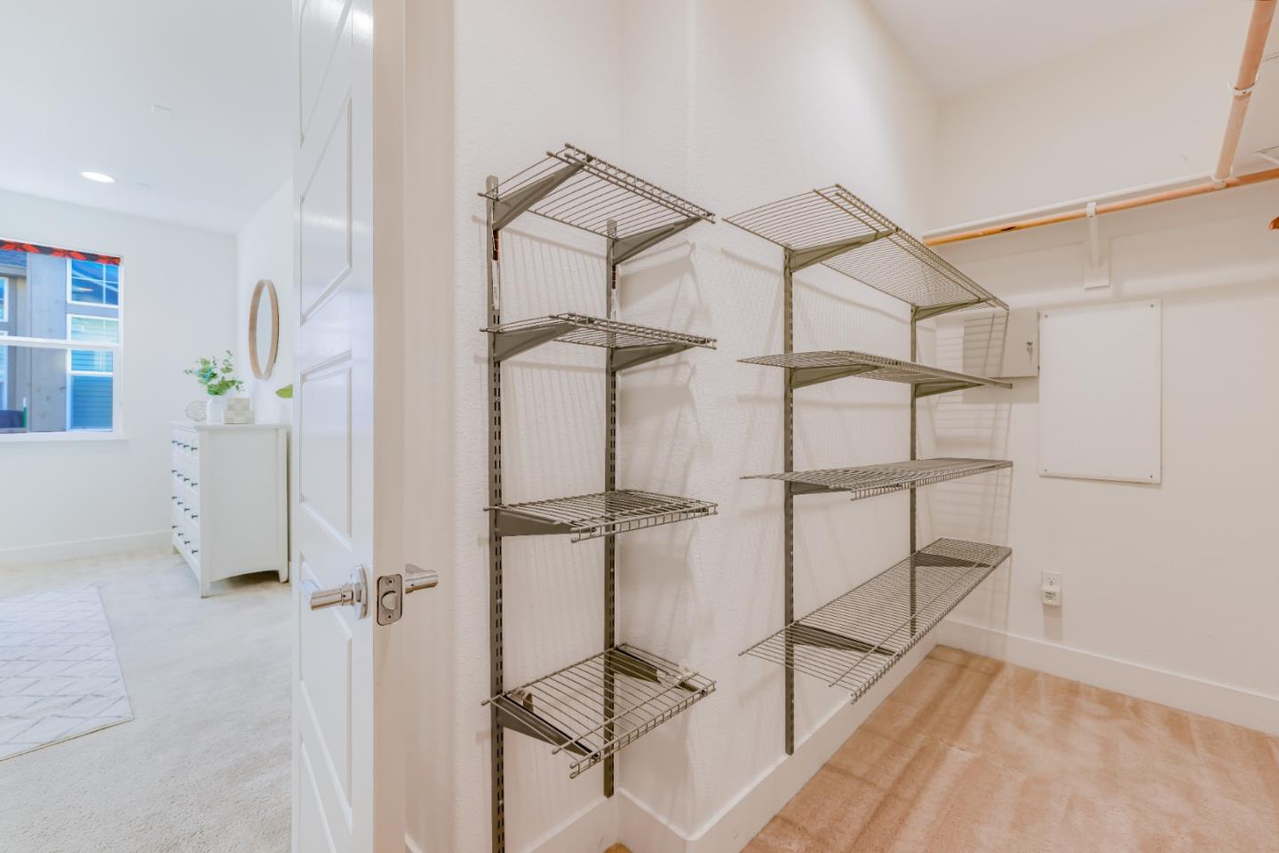 37431 Talamore Common Fremont, CA 94536 - Photo 28 of 41 a view of a room with rack on the wall and a window