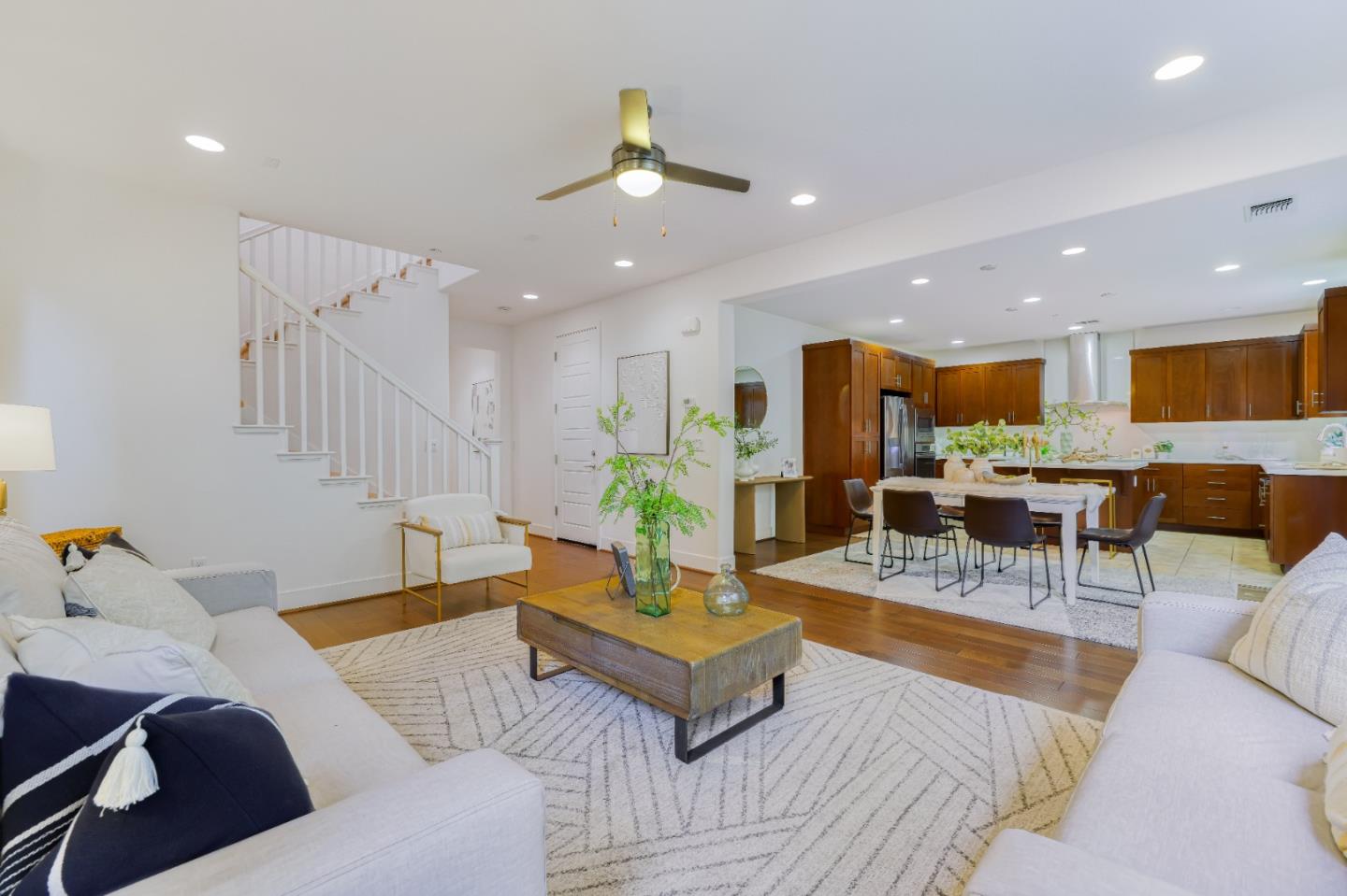 37431 Talamore Common Fremont, CA 94536 - Photo 10 of 41 a living room with furniture kitchen view and a chandelier
