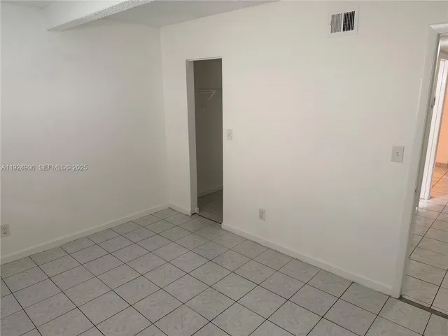a white toilet sitting next to a bath tub