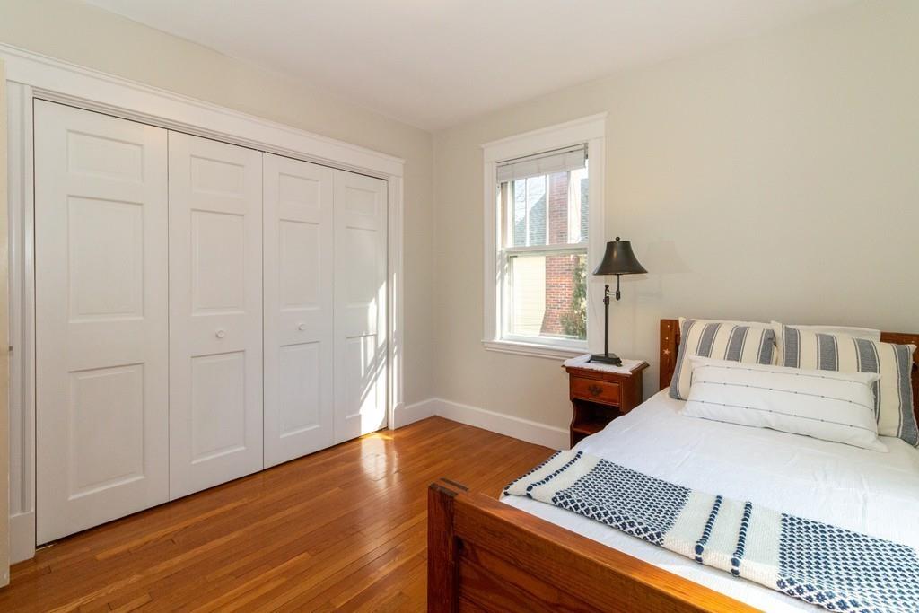 11 Thompson Road Marblehead, MA 01945 - Photo 31 of 37 a bedroom with a bed and wooden floor