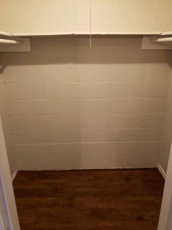 1202 Newning Avenue, Unit 113 Austin, TX 78704 - Photo 10 of 13 Laundry area featuring dark wood finished floors and baseboards