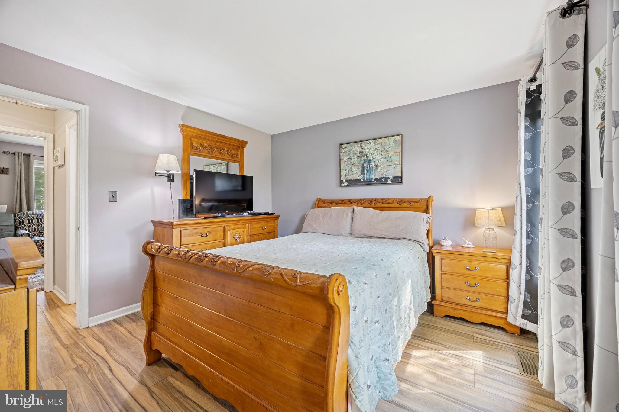 984 Rill Road Reading, PA 19606 - Photo 12 of 26 a bedroom with a bed and wooden floor
