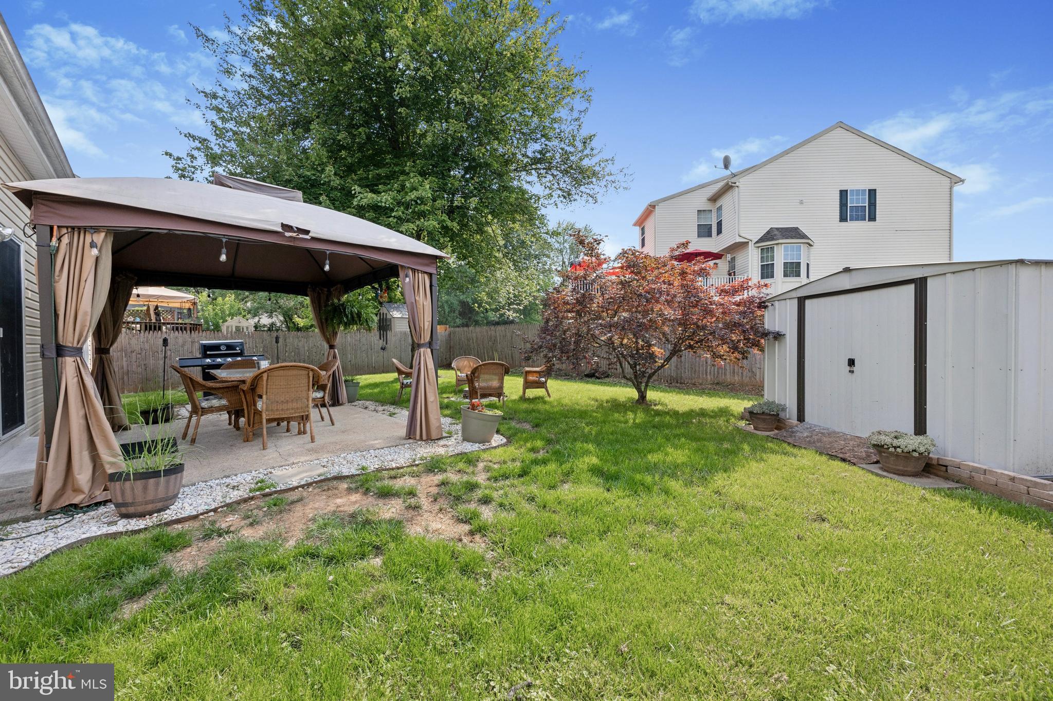 984 Rill Road Reading, PA 19606 - Photo 19 of 26 a view of a patio with table and chairs under an umbrella