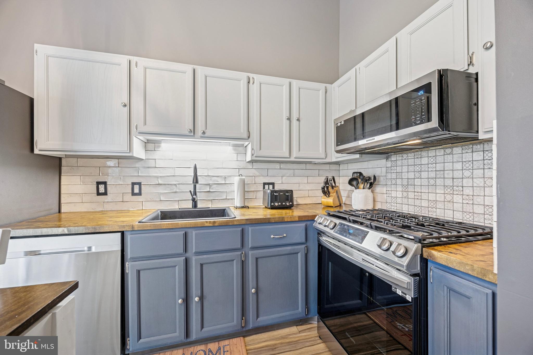 984 Rill Road Reading, PA 19606 - Photo 5 of 26 a kitchen with stainless steel appliances granite countertop a stove a sink dishwasher and a microwave oven on the granite countertops