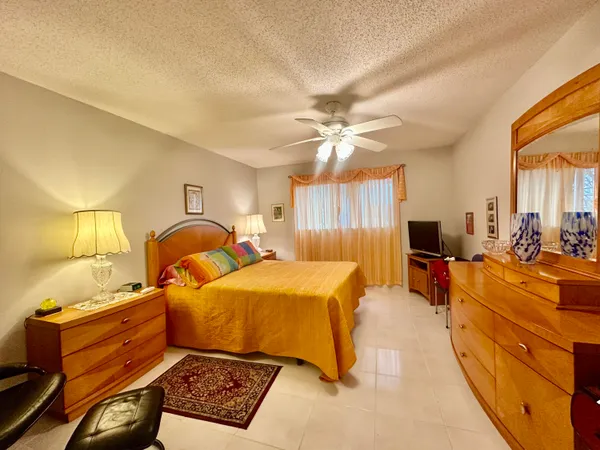 $239,900 | 19 Colonial Club Drive, Unit 105, Boynton Beach, FL 33435