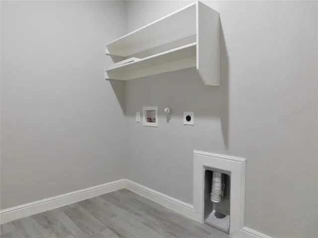 a bathroom with a shower and a sink