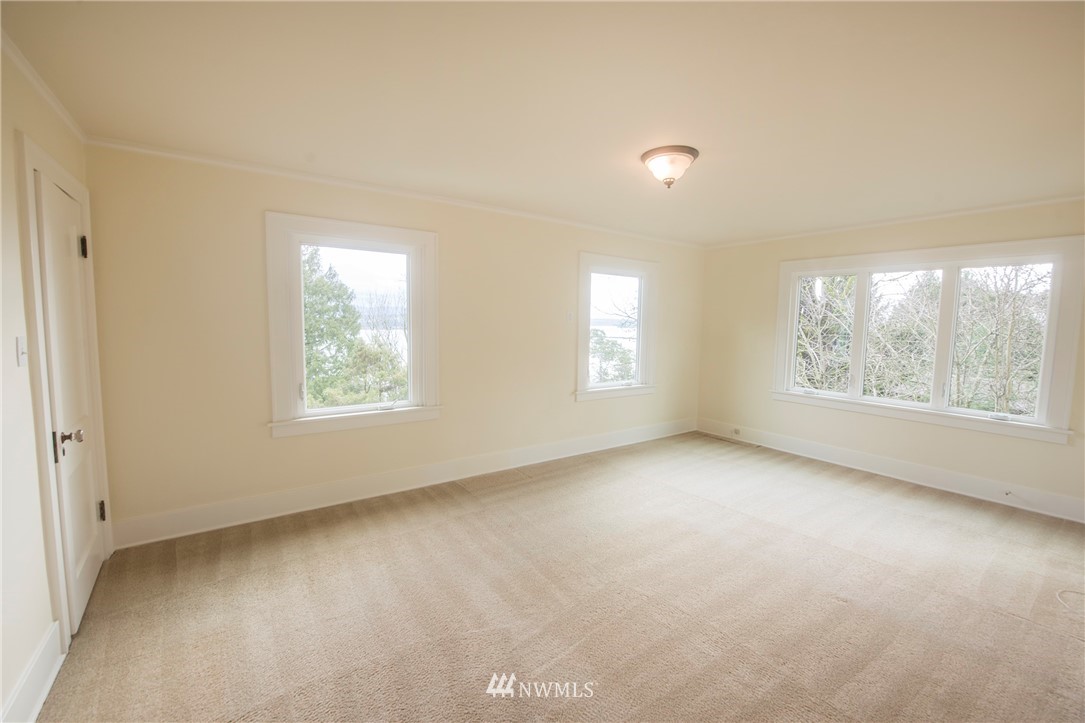 412 36th Avenue Seattle, WA 98122 - Photo 16 of 25 an empty room with windows and closet
