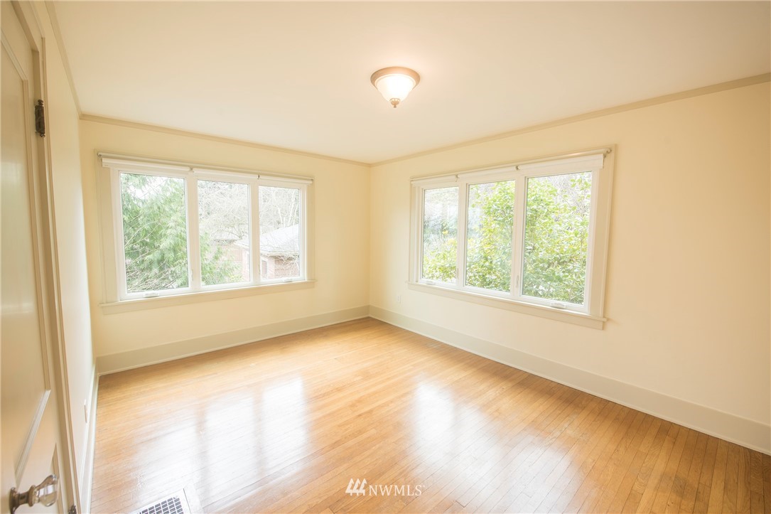 412 36th Avenue Seattle, WA 98122 - Photo 18 of 25 a view of an empty room with a window