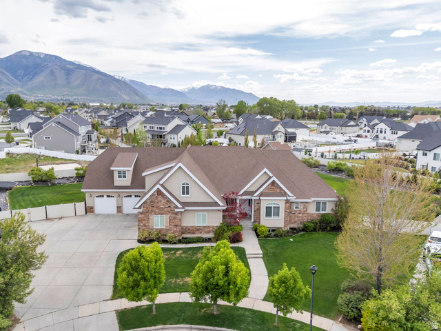 1355 West 1000 South Mapleton, UT 84664 - Photo 1 of 74 Craftsman house featuring stone siding, stucco siding, concrete driveway, a mountain view, and a residential view