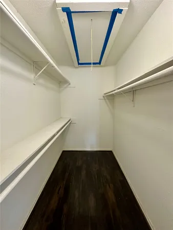a view of an empty walk in closet