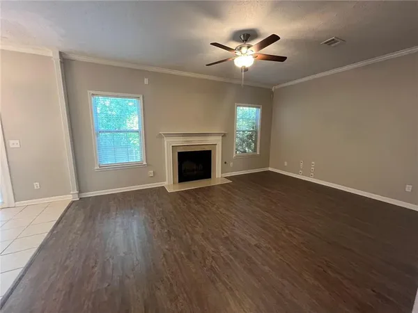 a kitchen with cabinets stainless steel appliances and a counter space