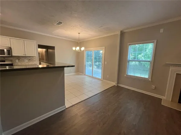 a stove top oven sitting inside of a kitchen