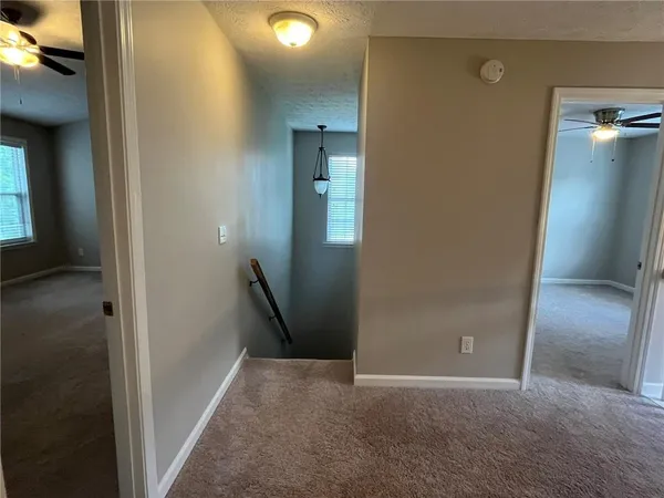 a view of a hallway to window