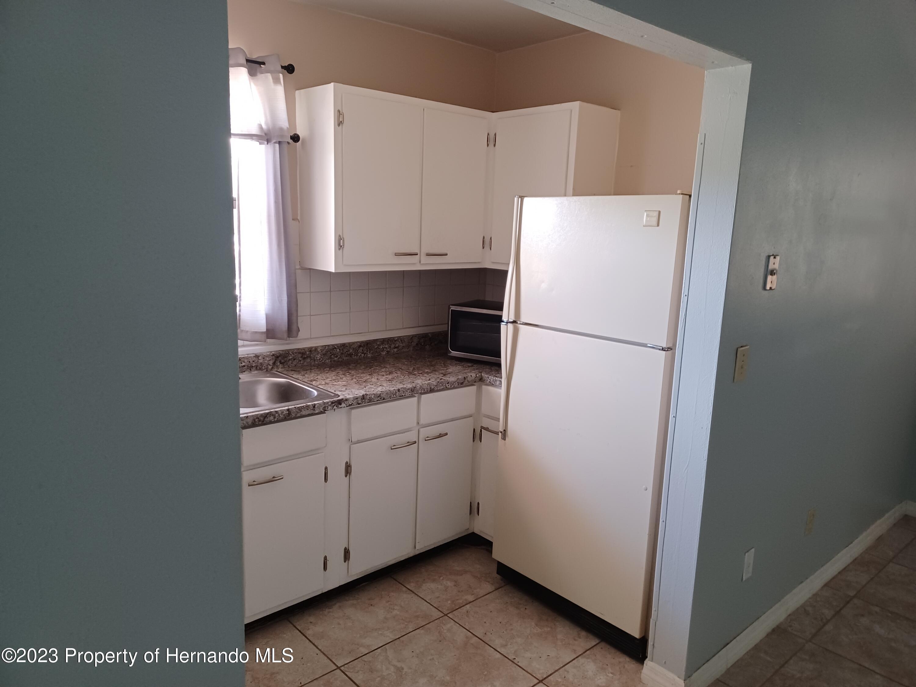595 Swallow Lane Spring Hill, FL 34606 - Photo 5 of 24 20230721_124535