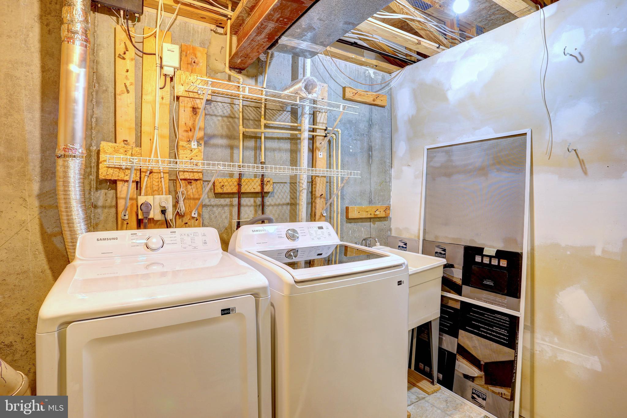 6136 Starburn Path Columbia, MD 21045 - Photo 22 of 35 a utility room with dryer and washer