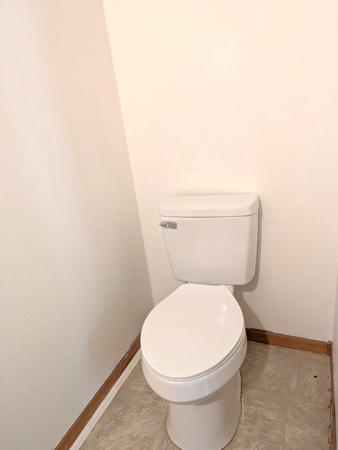 575 Jackson Ditch Road Harrington, DE 19952 - Photo 33 of 39 a white toilet sitting next to a white wall