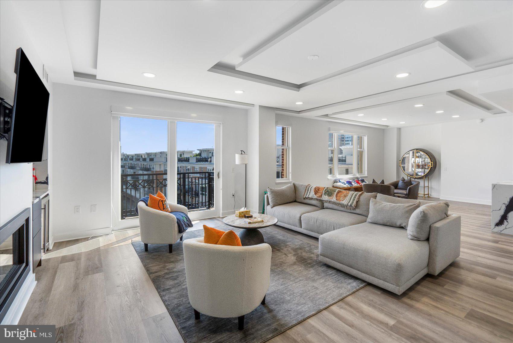 801 Key Highway, Unit T63 Baltimore, MD 21230 - Photo 11 of 43 a living room with fireplace furniture and a flat screen tv