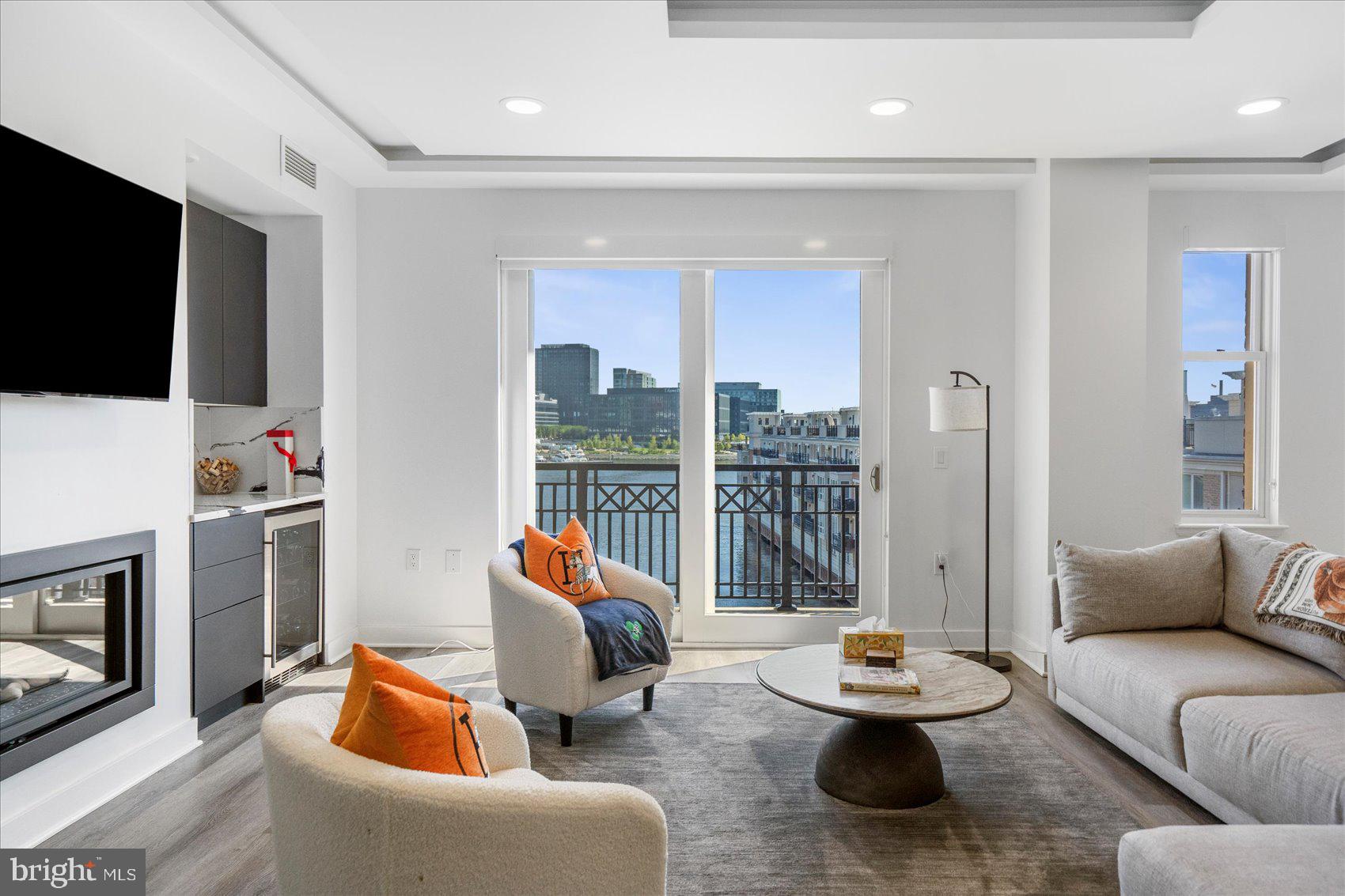 801 Key Highway, Unit T63 Baltimore, MD 21230 - Photo 12 of 43 a living room with furniture and a flat screen tv