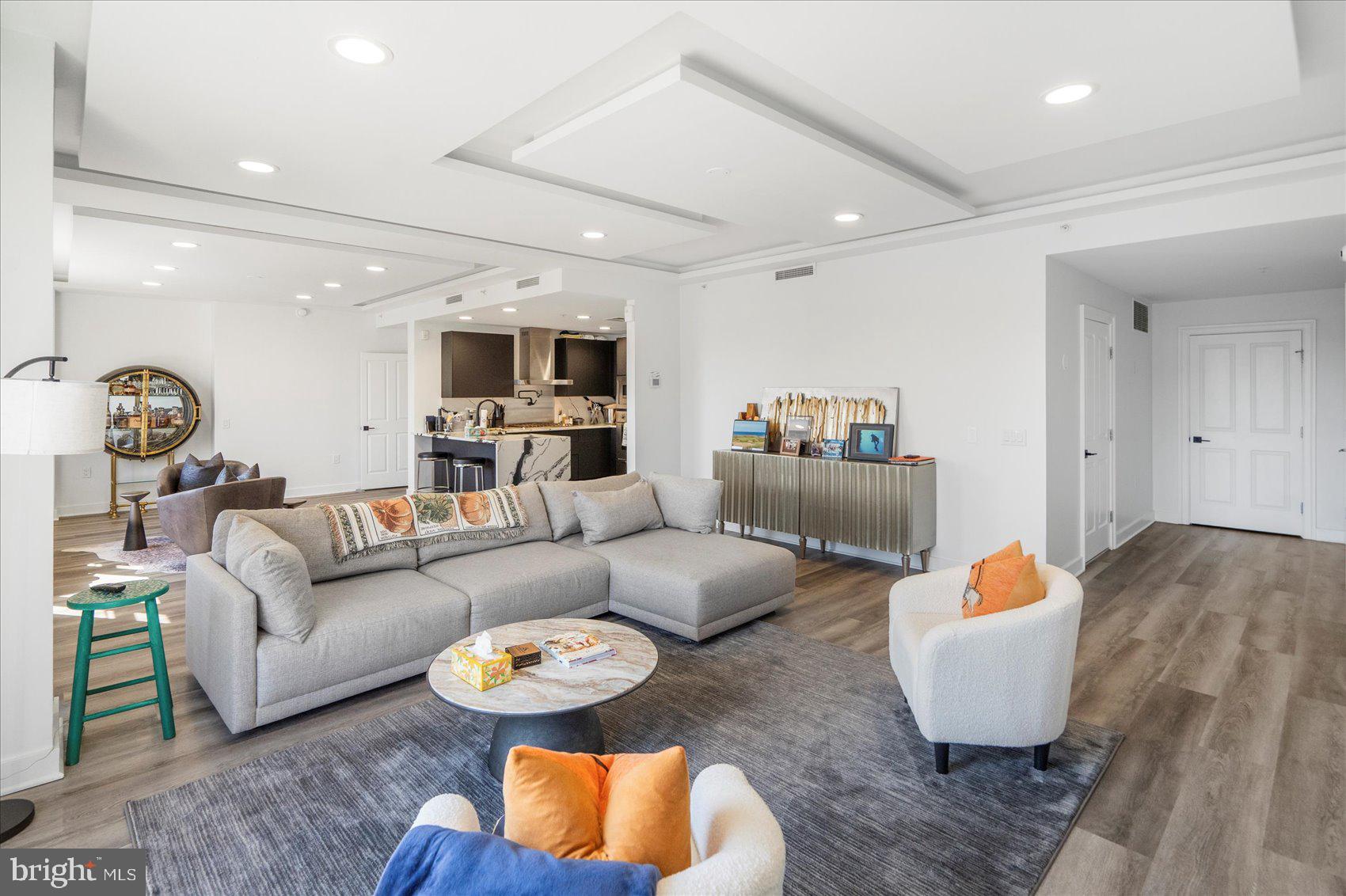 801 Key Highway, Unit T63 Baltimore, MD 21230 - Photo 13 of 43 a living room with furniture and a wooden floor