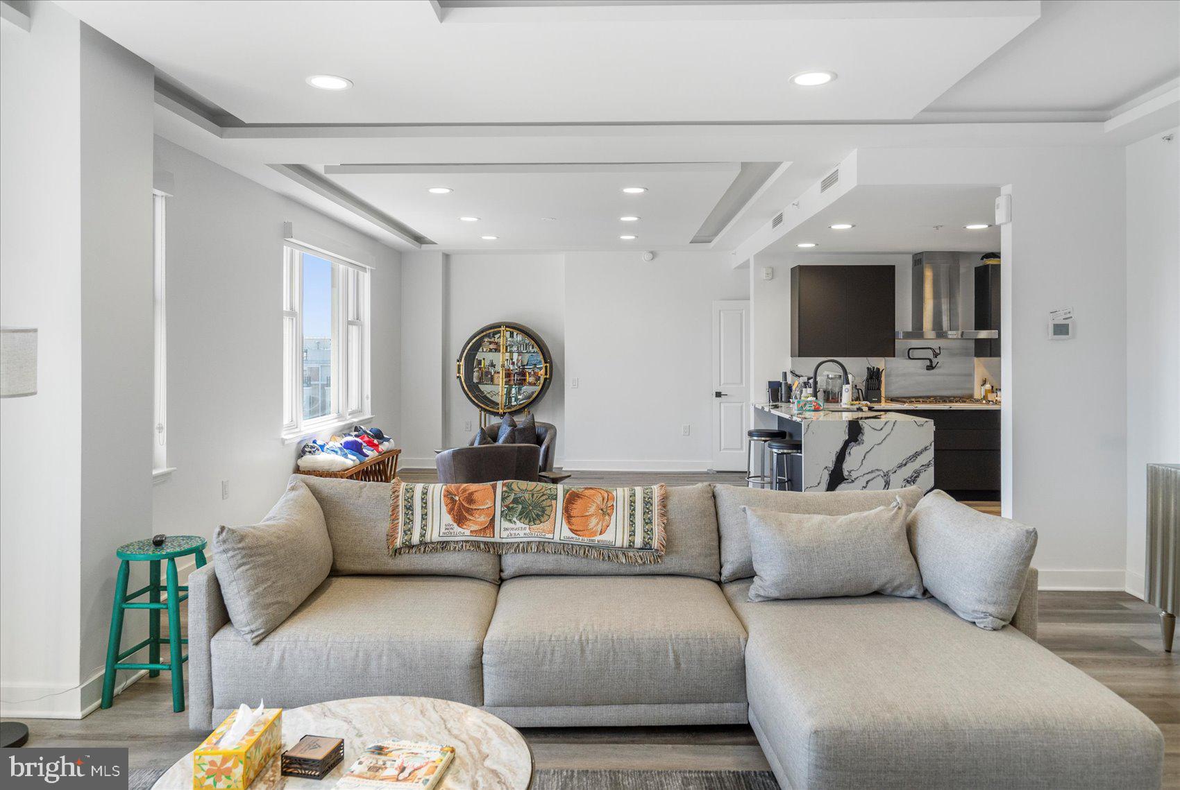 801 Key Highway, Unit T63 Baltimore, MD 21230 - Photo 15 of 43 a living room with furniture and a large window
