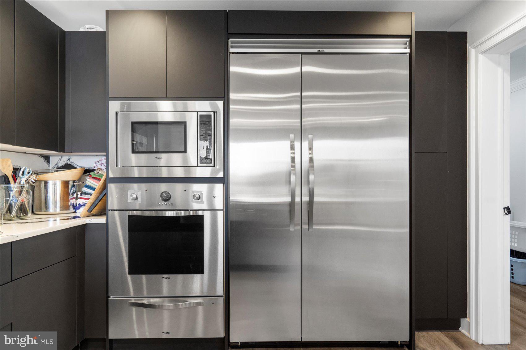 801 Key Highway, Unit T63 Baltimore, MD 21230 - Photo 17 of 43 a kitchen with a refrigerator and a stove
