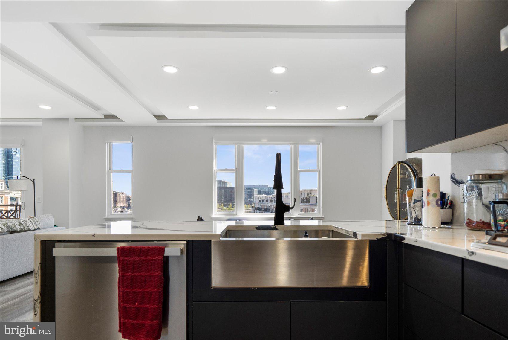801 Key Highway, Unit T63 Baltimore, MD 21230 - Photo 23 of 43 a kitchen with a sink and a refrigerator